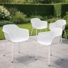 Lot de 4 chaises DRAK blanches avec accoudoirs, installées autour d’une table, usage intérieur et extérieur