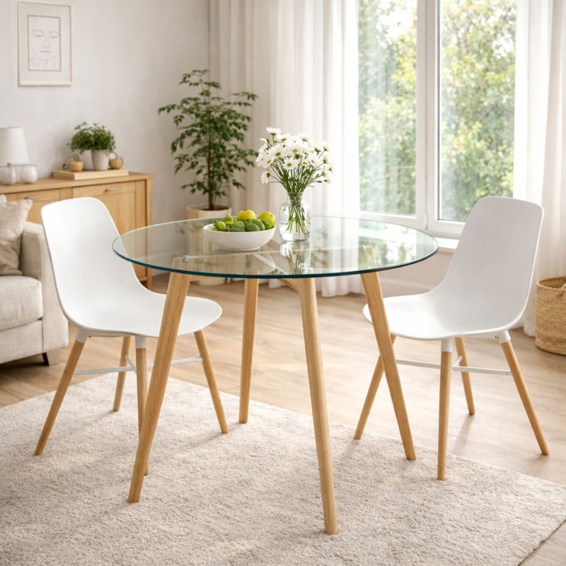 Table à manger ronde ANGELA en verre transparent dans un intérieur moderne lumineux